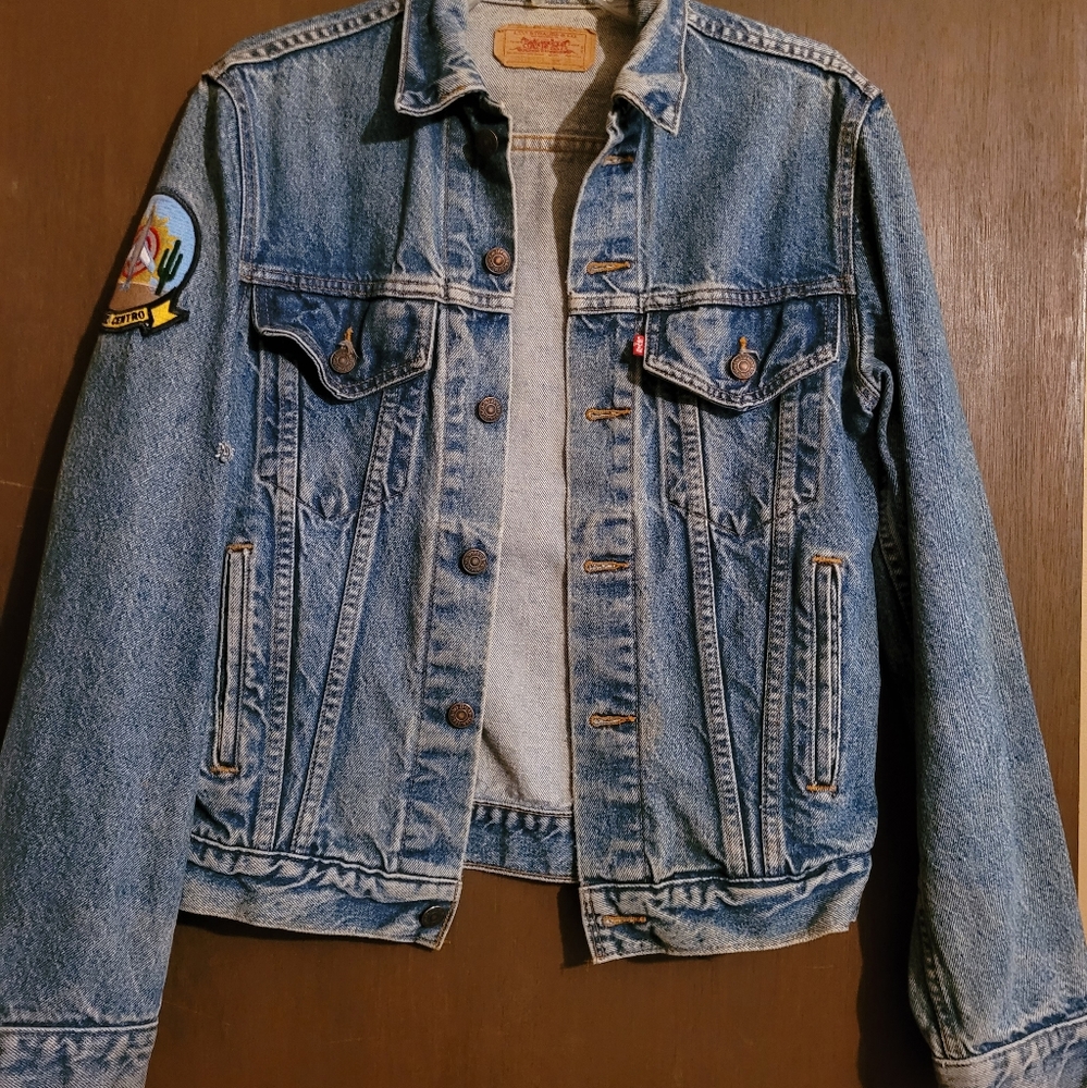 Levis trucker jacket vintage with military NAF patch.